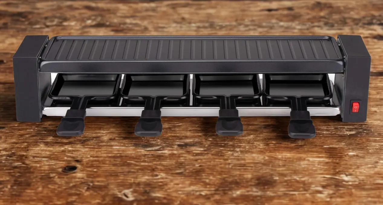 Alpina raclettte on wooden table